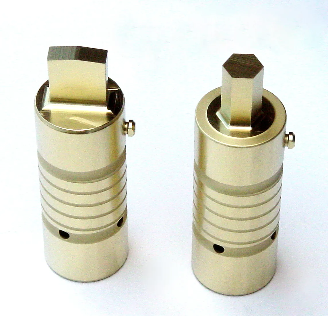 Alpha-coated punches with gold and silver finishes