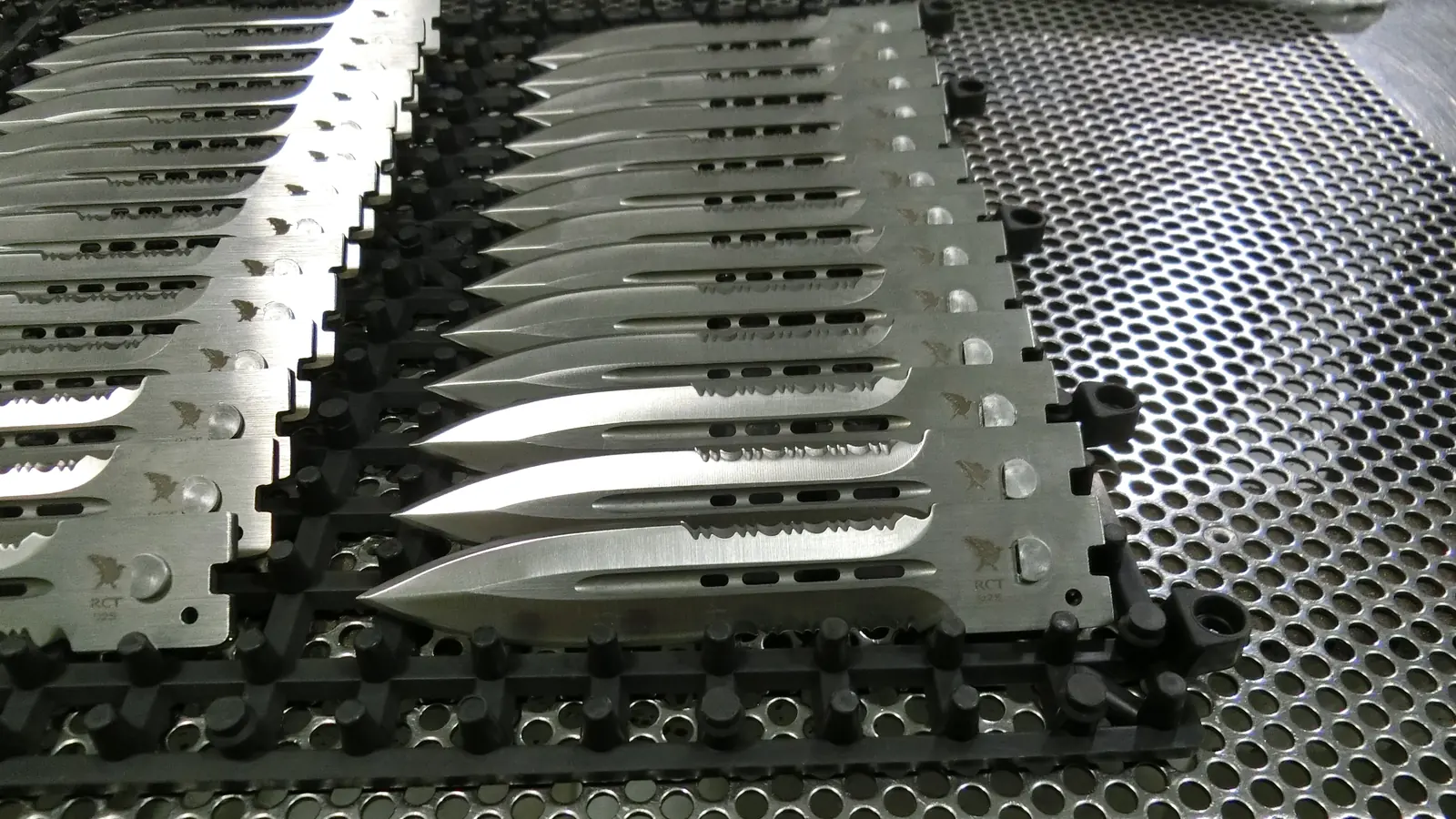 PVD-coated wear parts on a rack in the Fridley shop