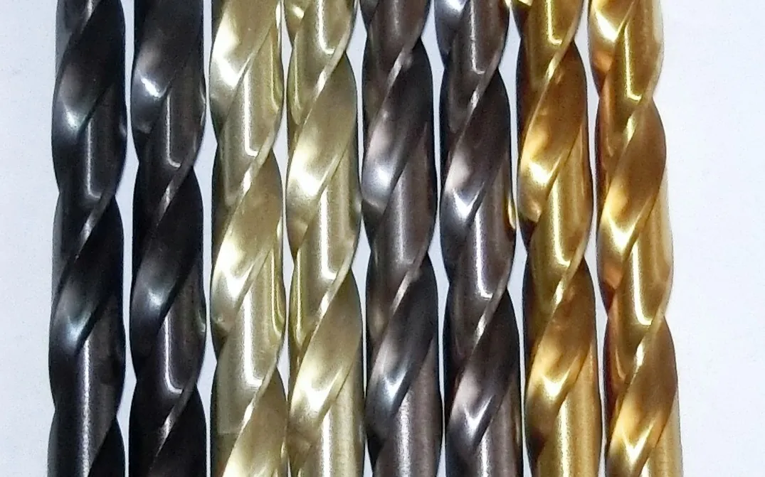 PVD-coated drills and cutting tools in gold, bronze, and dark finishes