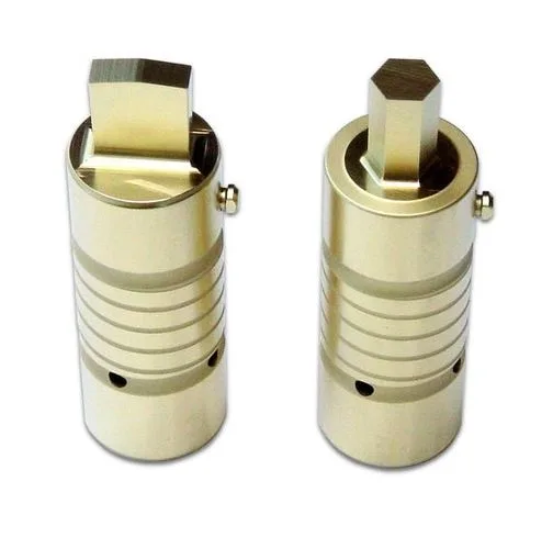 Two Alpha-coated turret punches with a light gold coating on the striking face